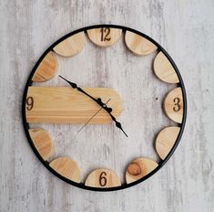 a clock made out of wood with numbers on it