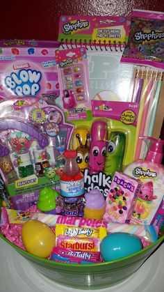 a basket filled with lots of toys on top of a table