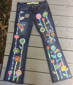 This is a custom listing for you... send me your jeans These specific jeans are sold but I can make you a cool pair that will be inspired from these! I can make these for you in any size - just send me your jeans The jeans that I will make for you will have hippie flowers/stems and flowers... .along the front of the legs as seen in the photo - they will not be these specific jeans or flowers. added distressed/ripped and repaired jean patches make these jeans look even more boho hippie I will wor Multicolor Mid-rise Denim Jeans, Spring Fitted Jeans With Patchwork, Spring Fitted Patchwork Jeans, Fitted Patchwork Jeans For Spring, Fitted Multicolor Denim Jeans, Fitted Bohemian Dark Wash Jeans, Fitted Multicolor Jeans For Spring, Denim Decorations, Upcycled Wardrobe