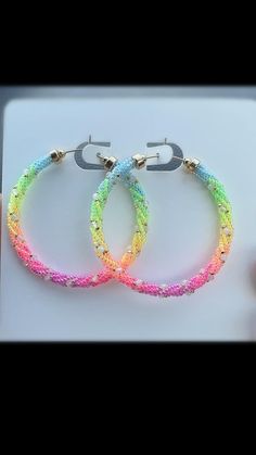 My favorite colorful rainbow hoop earrings with glass seed beads & tiny moonstones on 14K Gold Fill wire & accents. The perfect statement earring for a hot summer! Handmade by me in Tucson, AZ. 🏜️❤️ Trendy Hoop Jewelry For Jewelry Making, Trendy Hoop Beaded Earrings For Pierced Ears, Multicolor Hoop Earrings With Ear Wire, Trendy Handmade Round Hoop Earrings, Single Hoop Earring For Parties, Trendy Small Hoop Pierced Jewelry, Trendy Pierced Small Hoop Jewelry, Party Beaded Hoop Jewelry, Beaded Hoop Jewelry For Party