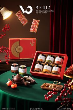 an advertisement for vo media featuring teas and cookies on a table with red curtains