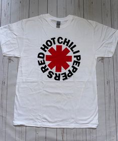 💎 Brand new officially licensed Red Hot Chili Peppers Classic Asteris White T-Shirt New Unisex 💎New without Tags  💎All of our items are 100% officially licensed and 100% authentic. 💎 All our imagery is taken live of the physical item, to give a real life image of the product. 💎Limited sizes and availability, grab yourself a great deal before it is too late 💎All our items are in stock and ready to be sent out right away from our UK warehouse. Red Band Logo T-shirt, Red Cotton T-shirt For Fan Conventions, Red Band Logo T-shirt With Crew Neck, Red Band Merch Top With Logo, Red Band Logo T-shirt Merch, Casual Red T-shirt With Band Logo, Red T-shirt With Band Logo For Fans, White Band Logo T-shirt Crew Neck, Red Band Logo Graphic Tee