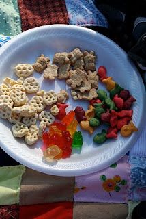 a white plate topped with lots of different types of food on top of a table