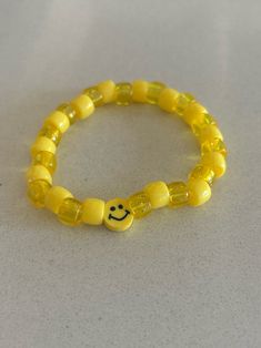 yellow smiley face beaded bracelet Trendy Yellow Jewelry With Letter Beads, Yellow Beaded Bracelets With Round Beads For Everyday, Casual Yellow Bracelets With Letter Beads, Adjustable Smiley Face Round Bead Jewelry, Trendy Stretch Bracelet With Smiley Face Round Beads, Trendy Smiley Face Stretch Bracelet With Round Beads, Yellow Letter Beads Friendship Bracelets, Trendy Yellow Beaded Bracelets With Letter Beads, Yellow Round Bead Bracelets For Everyday