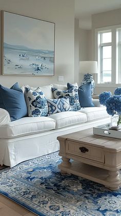 a living room with blue and white decor