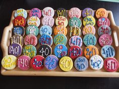 a tray filled with lots of decorated cookies