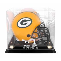 a green bay packers helmet in a glass case