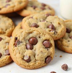 several chocolate chip cookies and a glass of milk