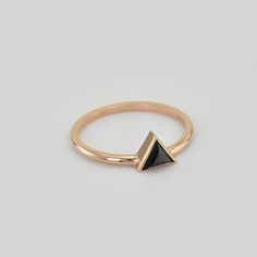 "This, edgy, black diamond triangular ring, is a must for all \"fashionistas\"! Sharp geometric jewely has become extremely popular and is featured in runway collections, fashion magazines and even on the red carpet. The point-down triangle celebrates female energy and the feminine elements of water and earth. This simplistic, but stunning ring can be handmade to your individual specifications, in 14k Rose, Yellow or White Gold with a highly polished finish. This is the perfect gift to embrace y Minimalist Triangle Jewelry For Formal Occasions, Modern Black Rings For Party, Modern Black Party Rings, Trendy Black Geometric Jewelry, Triangle Stone Ring, Ring With Triangle Stone, Modern Black Triangle Jewelry, Black Triangle Earring, Triangle Diamond