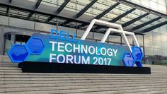 the dell technology forum sign is displayed on some steps