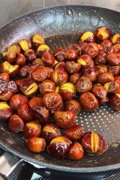 roasted chestnuts in a frying pan on the stove