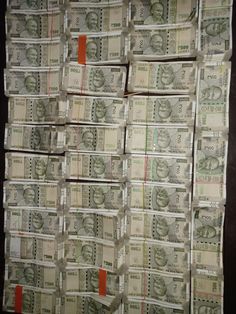 stacks of twenty dollar bills stacked on top of each other