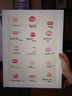 a person holding up a poster with different lipstick types on it