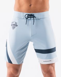 HIGHLIGHTS.. Unlined boardshort. 9” inseam Reflective branding at leg opening and back waistband Elastic waistband with adjustable self-tie drawcords Color-blocking panelling Water resistant fabric FIT SUGGESTION. This item runs true to Alphalete’s standard sizing.. Fit is based off of waist size in inches.. If you are between sizes, we recommend sizing up for a relaxed fit.. Eric is 6’2”/188cm, wearing a size 32. MATERIALS AND WASHING DIRECTIONS. 67% Nylon, 23% spandex. Due to the high saturati Athleisure Athletic Shorts For Water Sports With Built-in Shorts, White Training Bottoms With Elastic Side Panels, Sporty Fitted Surfing Bottoms, White Sporty Swim Trunks For Water Sports, Sporty White Shorts For Water Sports, Sporty Nylon Swim Trunks For Surfing, White Sporty Bottoms For Water Sports, Sporty Fitted Shorts With Functional Drawstring, Sporty Fitted White Swim Trunks