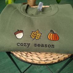 Autumn Day sweatshirt, Autumn Sweatshirt, fall embroidered crewneck for halloween, Halloween sweatshirt for autumn, Unisex halloween crewneck, Autumn sweatshirt for halloween I've included images showing the design on a Military Green Sweatshirt, please message me for specific sweatshirt colour requests/a request for changing the embroidery colour. Check out our Shop filled with so many Designs! https://www.etsy.com/uk/shop/TahikoStitch ⬅️⬅️⬅️ Don't FORGET to ❤️ like this listing 🤗 ▶️ HOW TO OR Embroidered Crew Neck Sweater For Fall, Halloween Long Sleeve Sweatshirt With Custom Embroidery, Long Sleeve Halloween Sweatshirt With Custom Embroidery, Long Sleeve Sweatshirt With Custom Embroidery For Halloween, Long Sleeve Custom Embroidered Sweatshirt For Halloween, Fall Green Tops With Embroidered Graphics, Embroidered Long Sleeve T-shirt For Fall, Embroidered Crew Neck Tops For Fall, Green Tops With Embroidered Graphics For Fall