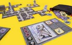 the board game star wars is set up on a yellow surface with its contents laid out