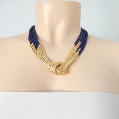 "Navy blue and gold necklace. Size shown is 18\". The gold beads are actually a light, refined shade of gold, so if you are worried about matching it, we have the earrings that do the trick: https://www.etsy.com/listing/218792281/light-gold-beaded-earrings-gold More items in navy: https://www.etsy.com/shop/StephanieMartinCo?ref=simple-shop-header-name&listing_id=262159552&ga_search_query=garnet&search_query=navy&page=1#items ❤ SIZES This item comes in several sizes, kindly choose Elegant Royal Blue Round Bead Necklaces, Elegant Royal Blue Round Beads Necklace, Elegant Royal Blue Round Beaded Necklace, Elegant Royal Blue Beaded Necklaces With Round Beads, Elegant Royal Blue Beaded Necklace With Round Beads, Elegant Blue Beaded Necklaces For Party, Elegant Royal Blue Necklace For Party, Elegant Royal Blue Party Necklace, Handmade Elegant Blue Bridal Necklace