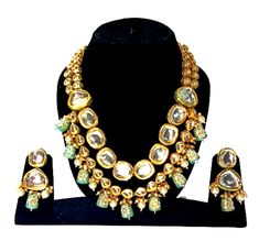 Bollywood Style Beauty - Kundans necklace jewellery set from Victor Choice  Made from high quality kundan. Micro gold plated for high durability. Buyers who purchased this necklace set from Victor Choice really liked this product. This product comes in Victor Choice branded packaging Skin friendly - Nickel free and lead free as per international standards. Anti-allergic and safe for skin Size - Necklace length - 45 cms, earrings length - 3. 8 cms Brand - Victor Choice is a well known brand acros Designer Gold Jewelry With Meenakari, Designer Kundan Gold Necklace, Festive Designer Gold Kundan Necklace, Designer Kundan Gold Necklaces, Designer Gold Necklace For Festive Occasions, Designer Gold Kundan Necklace For Festive Occasions, Designer Gold Necklaces For Festive Season, Designer Gold Kundan Necklace, Designer Kundan Jewelry For Gifts