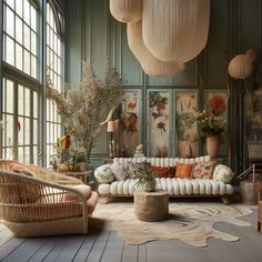 a living room filled with lots of furniture next to large windows and potted plants