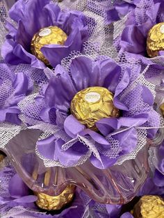 purple and gold chocolates in a glass vase