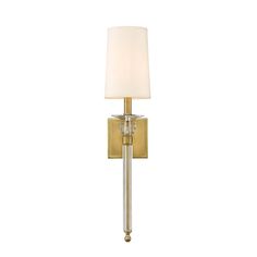 a wall light with a white shade on the side and a gold metal frame around it