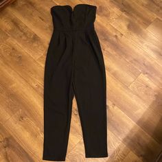 Black Pants Romper Suit In Medium Brand New Black Spring Pantsuit For Date Night, Black Pantsuit For Spring Date Night, Black Pantsuit For Date Night In Spring, Casual Black Pantsuit For Night Out, Black Spring Pantsuit For Going Out, Black Pantsuit For Going Out In Spring, Black Casual Strapless Jumpsuit For Work, Spring Black High-waisted Pantsuit, Casual Black Strapless Jumpsuit With High Waist