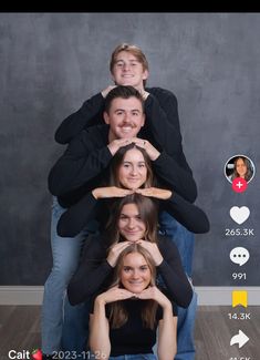 a group of people sitting on top of each other