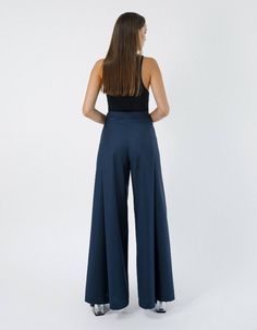 High-waisted wide-leg pants IPANTS are an investment piece your basic wardrobe totally needs. Palazzo have a laconic design with hidden zip and minimalistic metal button on the side. Comfortable side pockets and pleats on front and back.Care: Professional dry clean. Iron at low temperature.Composition: 70% wool, 28% viscose, 2% elastane.Custom sizing is available upon request. Please take note that custom-made items can not be returned. We will be glad to assist You in taking Your measurements. Modern Tailored Wide Leg Pantsuit, Wide Leg Culottes For Office, Business Casual Wide Leg Bottoms, Modern High-waisted Wide Leg Pants, Modern Tailored Wide Leg Bottoms, Modern Tailored High Waist Wide Leg Pants, Tailored High Waist Modern Wide Leg Pants, High Waist Culottes For Business Casual, Modern Wide Leg Pantsuit For Office