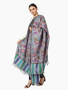 Wrap yourself in luxury with the Floral Steel Blue Pashmina Kani Shawl. Handcrafted using traditional Kashmiri kani weaving techniques, this pure pashmina shawl is a stunning work of art. Add a touch of elegance to any outfit with this beautiful kashmiri pashmina kani shawl. • Handwoven Kani Weave Shawl – Wrap• Hand-woven 100% Cashmere Pashmina (World’s Finest Quality Cashmere)• Size: 100 cm X 203 cm / 40 Inch X 80 Inch / 1.1 x 2.2 Yards (Approx)• Base Color: Steel Blue• Weave Colors: Multiple• Weave Colors, Woven Shawls, Blue Weave, Hand Looms, Cashmere Pashmina, Pashmina Shawl, Shawl Wrap, Elegant Accessories, Cashmere Wool