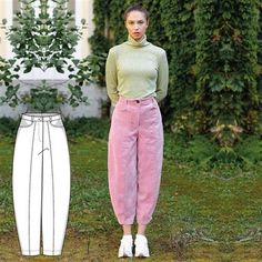 a woman standing next to a white and pink pants