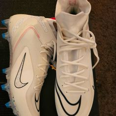 a pair of white and black nike shoes