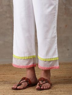 A three piece soft cotton kurta set in white comes with an attached mulmul lining. It has colour block laces with organza insert on the neck,sleeves and pants. It is paired with a white soft cotton straight pant with an attached mulmul lining with organza insert and colour block laces. Color: White Fabric Composition: Kurta Set - Soft cotton Dupatta - Organza Note: The product will be delivered within 20-25 days of order placed Care Instruction: Dry Clean Only. Do not use heavy Iron White Cotton Silk Sets For Diwali, Diwali White Cotton Silk Sets, Designer Cotton Palazzo Set With Gota Work, White Cotton Silk Designer Sets, White Cotton Silk Sets For Designer Wear, White Cotton Silk Designer Wear Sets, White Cotton Silk Palazzo Set For Eid, Traditional White Palazzo Set With Lace Work, White Cotton Anarkali Kurta