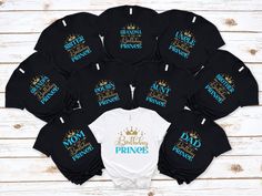 a bunch of shirts that are on top of a wooden table with the names of each princess