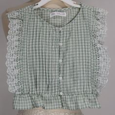 Zara Green Sage/White Eyelet Top! This Blouse Is So Delicate And Summery.... Condition. New Without Tags. No Flaws Size: Tag States Size 6 But It Runs Small - It Fits More Like A Size 5 Material: Cotton. Front Button Closure Please Ask All Questions Before Buying Summer Sleeveless Gingham Blouse, Spring Sleeveless Gingham Blouse, Spring Gingham Sleeveless Blouse, Sleeveless Gingham Blouse For Summer, Sleeveless Gingham Blouse For Spring, Cute Sleeveless Blouse With Ruffles, Cute Sleeveless Top With Lace Trim, Sleeveless Ruffled Tops For Picnic, Cottagecore Tops For Summer Daywear