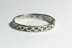 Silver Texture Ring One Sterling silver band. Assorted widths and sizes available. Great For stacking, gift giving, promise ring, wedding bands. Solid Sterling Silver Hammered patterns Silver Texture Ring Stackable Band Rings As Gift, Minimalist Band Ring For Gifts, Minimalist Band Ring For Gift, Minimalist Band Rings As Gifts, Simple Stacking Rings, Silver Ring Simple, Silver Texture, Silver Rings Simple, Silver Stacking Rings