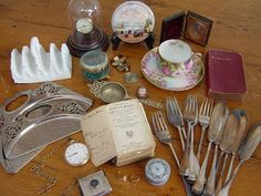 an assortment of antique silverware and other items on a wooden table with the words preserve family treasures