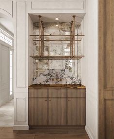 a bathroom with marble counter tops and wooden cabinets in the corner, along with wood flooring