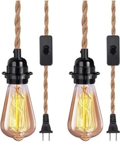 three light bulbs are hanging from rope with one bulb turned on and the other turned off