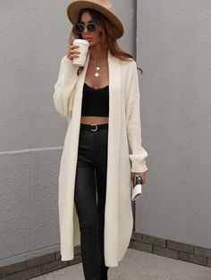 Our Drucilla Cardigan comes in a milky cream colour. Crafted from a fabric that's perfect for the breezy season, this cardi features an open front, long relaxed sleeves, a side pocket, and over knee-length hem. It easily pairs with prints and plains. Pair with jeans for a lazy day outfit or complete the look with our Jady Rose Knight Luxe Boot. Size Guide: Ambre is 5’2” tall, and has a 33.2” bust, 24.5”waist, & 36.7” hips. She is wearing a S / US 4 / AU 8. This cardigan is true to size. Feature: Solid Color Sweater, Gilet Long, Knitting Women Cardigan, Saint John, Duster Cardigan, Sleeves Clothing, Knit Sleeve, White Cardigan, Loose Sweater