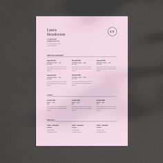 a clean and minimal resume is displayed on a gray surface with a shadow from the paper