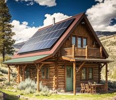 a small log cabin with solar panels on the roof