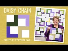 a woman holding up a quilt in front of a yellow background with the words daisy chain