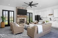 a living room filled with furniture and a fire place in the middle of a kitchen