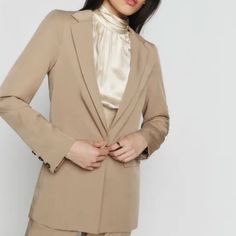 Tencel Twill Blazer. Notched Lapel Single-Button Closure Flap Pockets At Waist Three-Button Surgeon's Cuffs Full Viscose Twill Lining Tortoiseshell Hardware Neutral Blazer With Buttons For Work, Elegant Neutral Blazer With Double Button Closure, Elegant Neutral Outerwear With Single Button, Chic Brown Single Button Blazer, Neutral Button-up Blazer For Work, Fitted Brown Blazer With Hidden Button Closure, Elegant Neutral Button-up Blazer, Brown Long Sleeve Blazer With Hidden Button Closure, Chic Brown Single-button Blazer