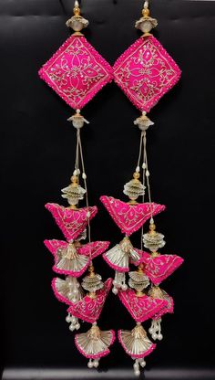 15" fuchsia pink triangular cushion motif zardosi embroider couture tassel with bead | bridal wedding lehenga sewing hanging tassel latkanHandmade Hanging/tasselsMaterial:Silk, Thread, MotifsPackage Contents: 4Key Features:Embroidery art workThis  is good match with both Indian and western outfits and are superb for wedding and festive parties.This would be best complement to your designer saree, lenhga or any other kind of dress.This is the combination of traditional and modern embroidery work. Lehenga Hanging Ideas, Lengha Latkan Design, Tasal Designe For Lehanga, Lehnga Latkan Designs, Lehnga Tassels, Dress Hanging Ideas, Lehenga Latkan Designs, Blouse Hangings Tassels, Latkans For Lehenga Handmade