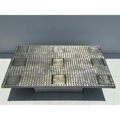 a metal table with squares on it