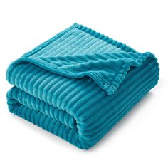 the blue blanket is folded on top of each other and it looks like they're ready to be washed