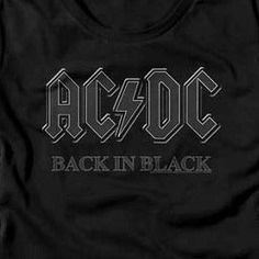 Junior's ACDC Back In Black T-Shirt Love classic rock? Show it off in this stylish ACDC Back In Black T-Shirt! Its lightweight, breathable cotton makes for comfortable all-day wear, so you can turn up the music and rock out with style. What are you waiting for? Get your ACDC T-Shirt now! Officially Licensed 60% Cotton, 40% Polyester Short Sleeves Color: Black Printed in the U.S.A. with eco-friendly inks Machine Washable Listed in juniors sizes ** This product ships direct from the manufacturer w Black Cotton Rock And Roll T-shirt, Black Band Logo Crew Neck Top, Black Crew Neck Tops With Band Logo, Black Crew Neck Top With Band Logo, Black Logo Print Top For Concert, Black Band Logo Tops For Summer, Edgy Cotton Tops With Band Logo, Rock Style Logo Print Tops For Concert, Black Text Print Top For Concert