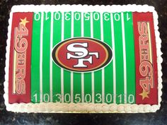 a cake decorated to look like a football field with the san francisco logo on it