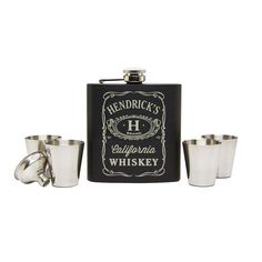 three shot glasses and a flask with the name bradley on it